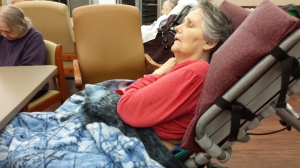 Mom was having a fitful sleep. Her legs were wrapped up in padding, she had a blanket over her lap and she was in a specialized wheelchair that tilts. 